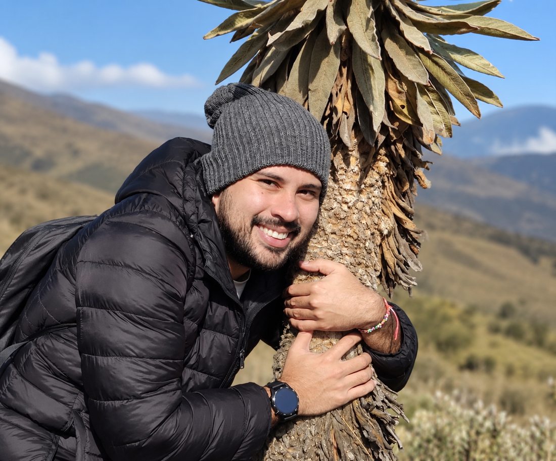 Nicolás smiling outdoors in the mountains